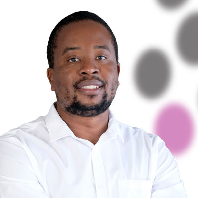 A man in a white shirt is standing in front of a white background.