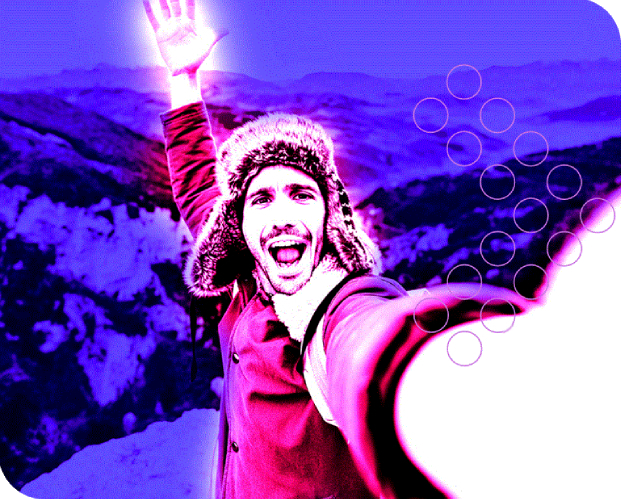 A man is taking a selfie with a purple background.